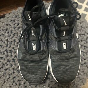 Nike women’s Black and White Training Sneakers